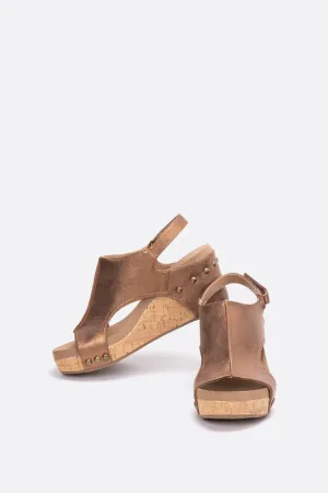 The Carley Faux Leather Wedge Sandal In Antique Bronze